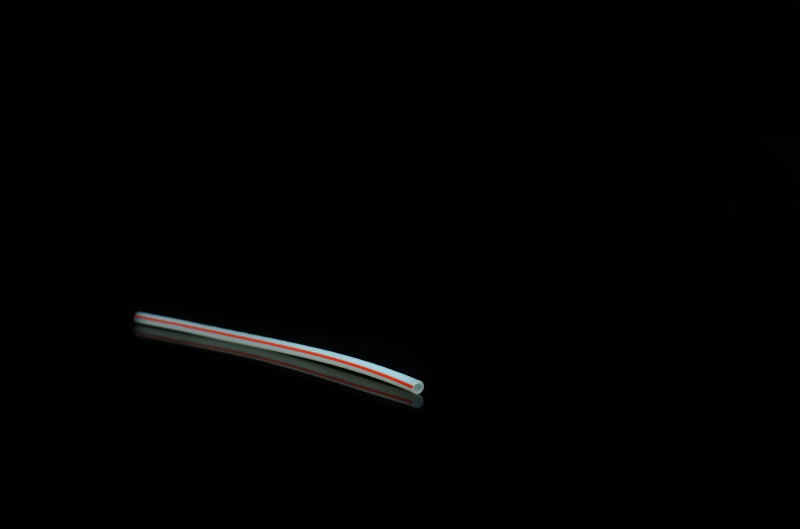 PTFE tube with a coloured marking stripe along its length